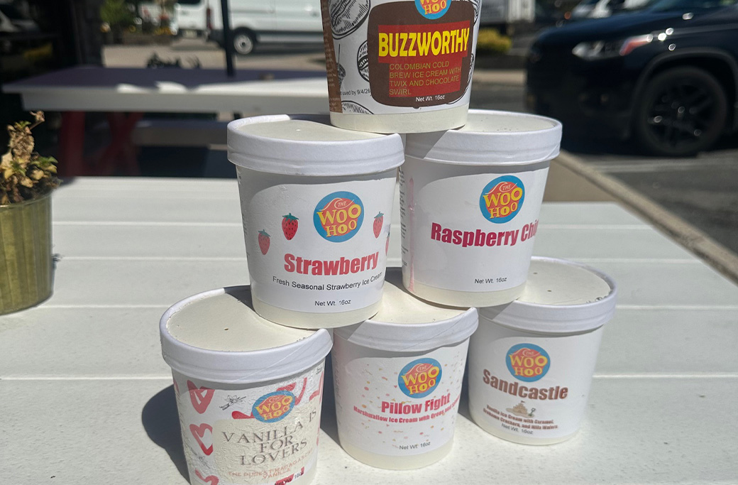 Display of Woo Hoo Ice Cream flavors including Colombian Cold Brew, Pillow Fight, Sandcastle, Strawberry, Raspberry Chip, and Vanilla for Lovers at Fusaro’s