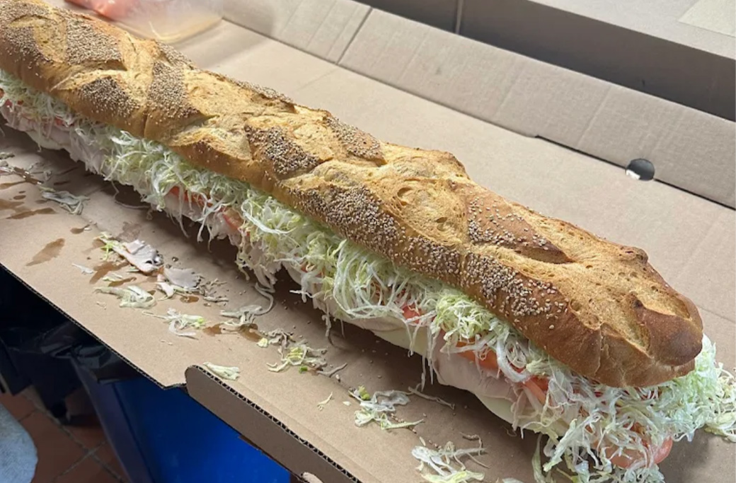 Wrap platters and Italian subs from Fusaro's served picnic-style at a park concert.