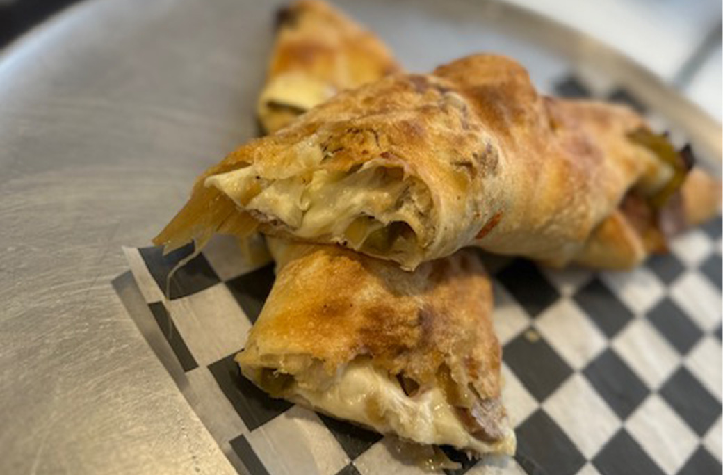 Cheesesteak roll with onions made with fresh pizza dough at Fusaro’s Pizza & Pasta