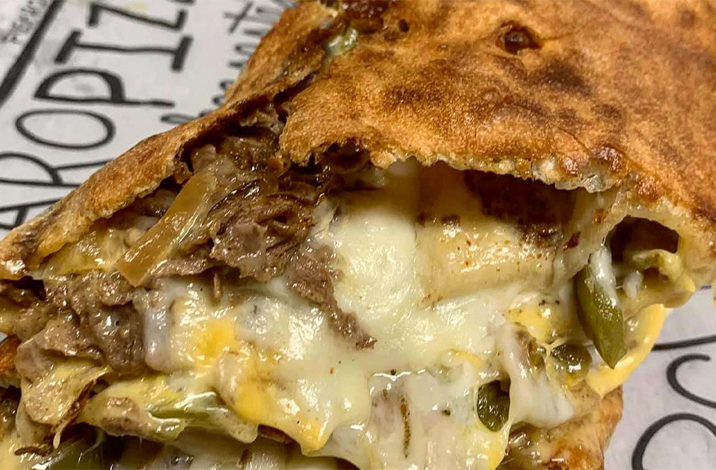 Cheesesteak stromboli with peppers and onions baked fresh at Fusaro’s Pizza & Pasta