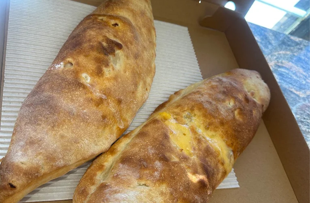 Comparison of Fusaro’s calzone and stromboli showing the difference in shape