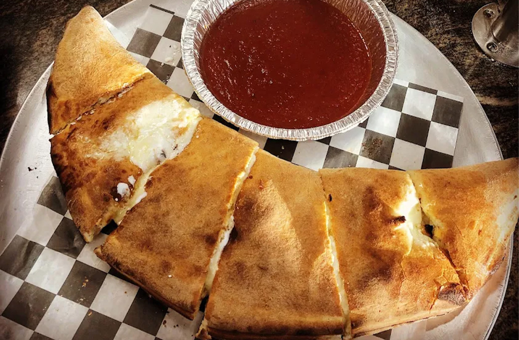 Fresh baked calzone with ricotta and mozzarella from Fusaro’s Pizza & Pasta in Manahawkin NJ