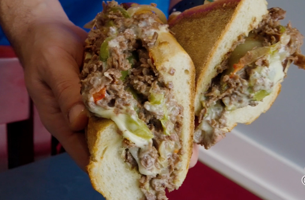 Fusaro's cheesesteak with chopped steak and melted cheese on an Italian roll